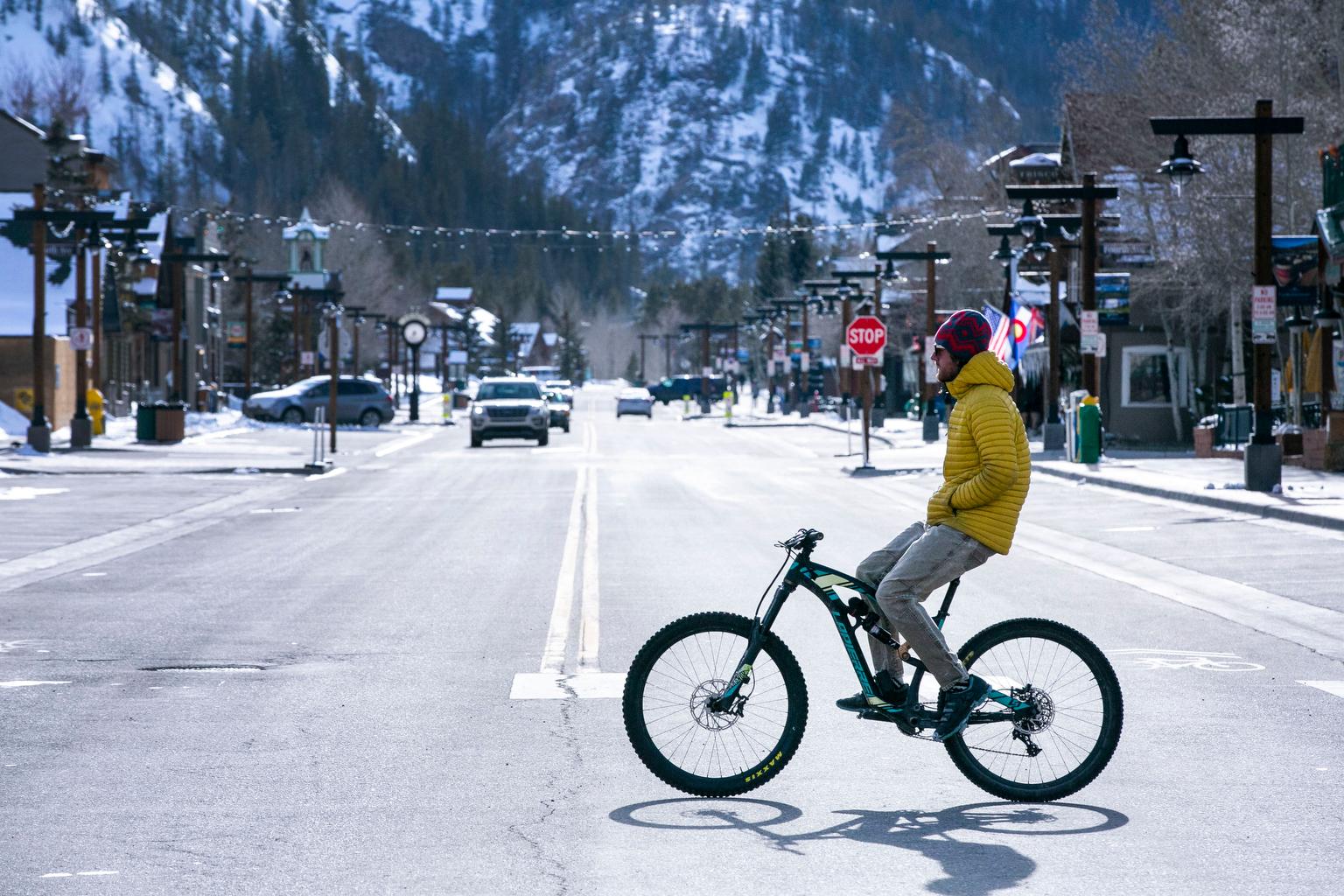 Bicyclist casually crosses Frisco's main street