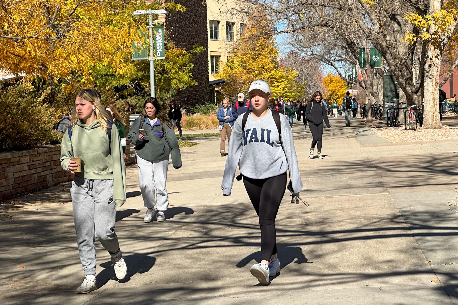 Students walk to classes on a fall day on Colorado State University's Fort Collins campus.