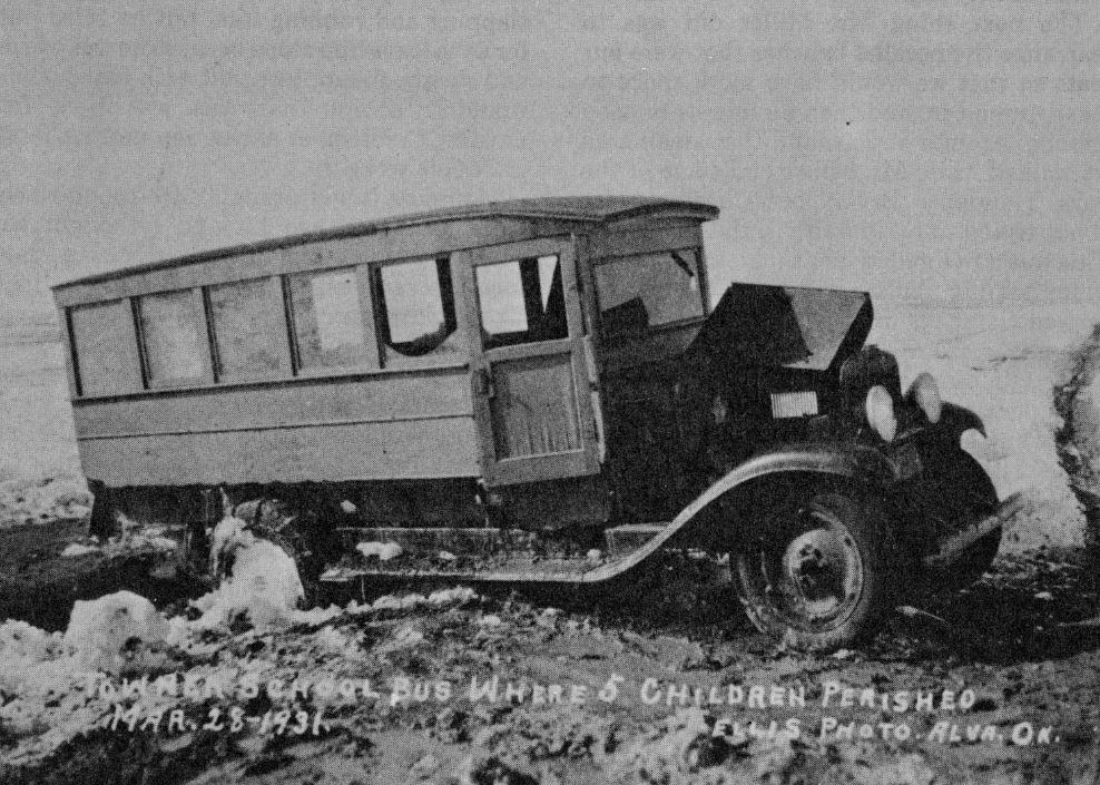 Black and white photo of a makeshift school bus.