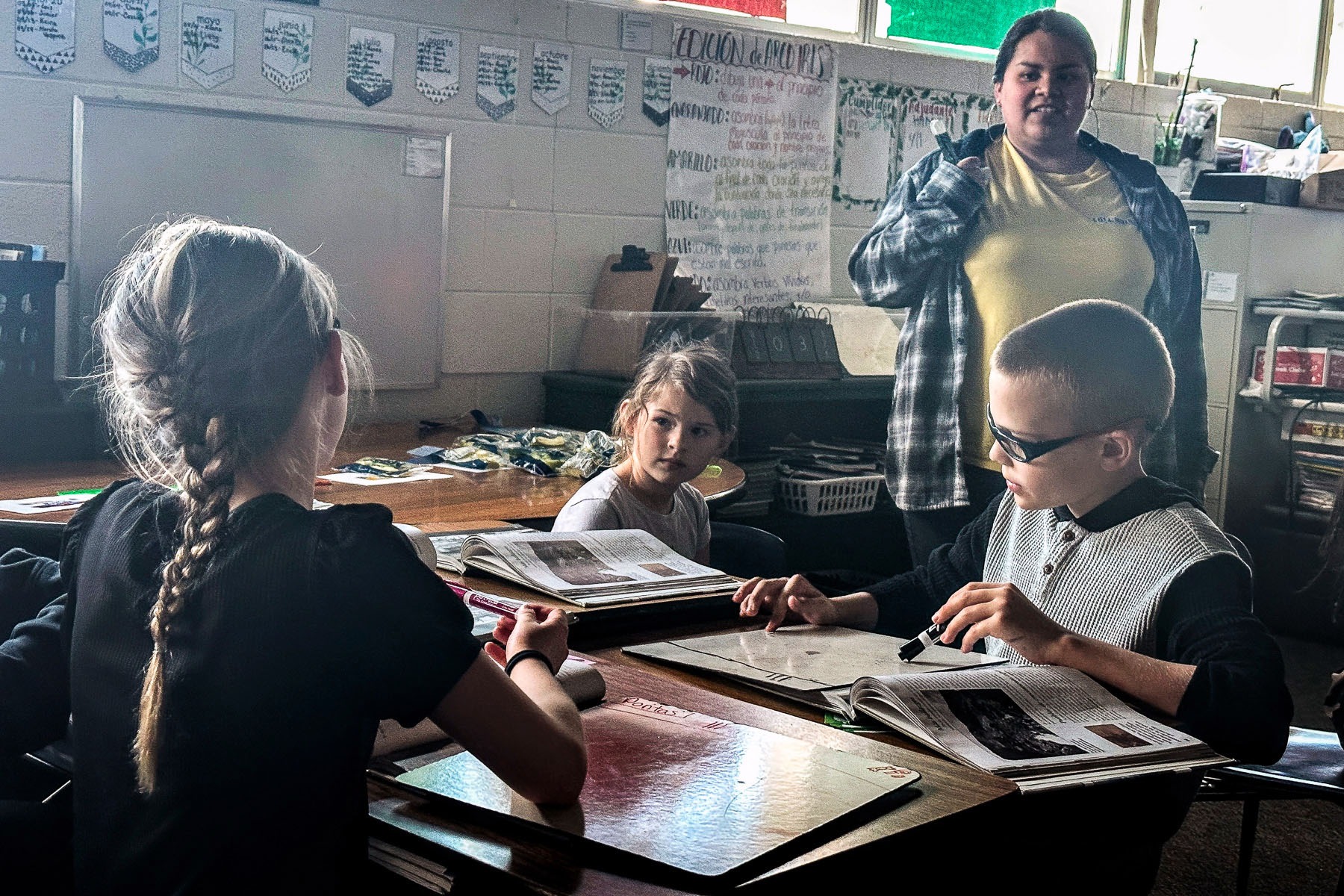 A fourth grade student makes a point to her teacher